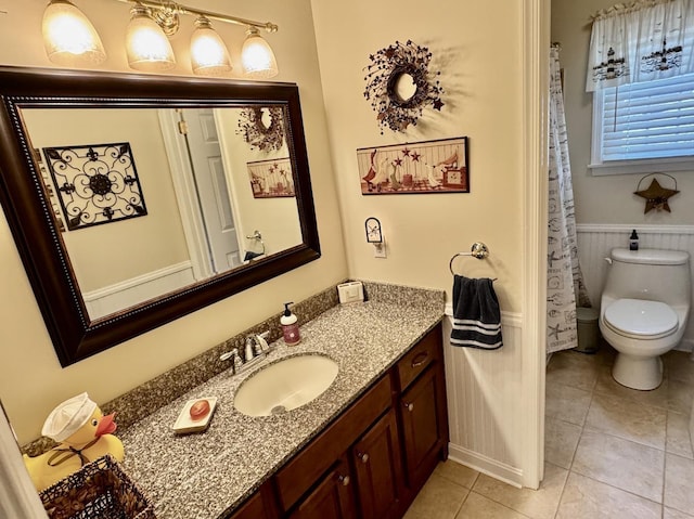 63 Cape Woods Rd, North Cape May, NJ 08204 - full bathroom featuring vanity, tile patterned flooring, and wainscoting