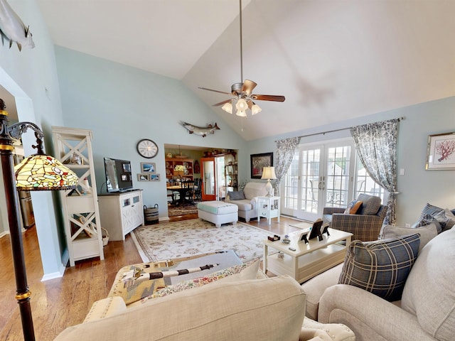 63 Cape Woods Rd, North Cape May, NJ 08204 - living room featuring light wood finished floors, a ceiling fan, french doors, and high vaulted ceiling