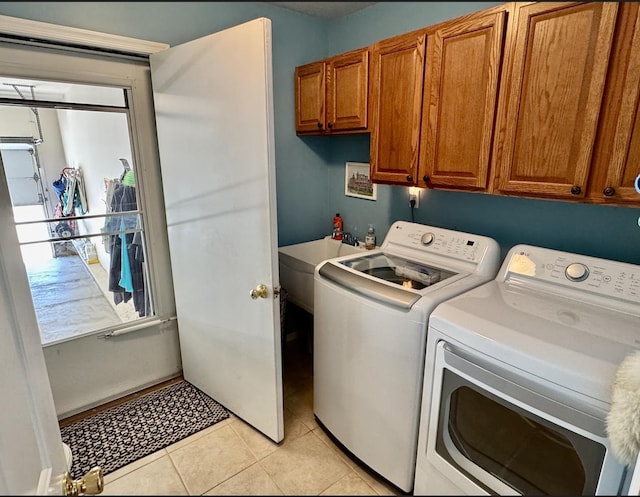 63 Cape Woods Rd, North Cape May, NJ 08204 - laundry area featuring cabinet space, independent washer and dryer, and light tile patterned floors