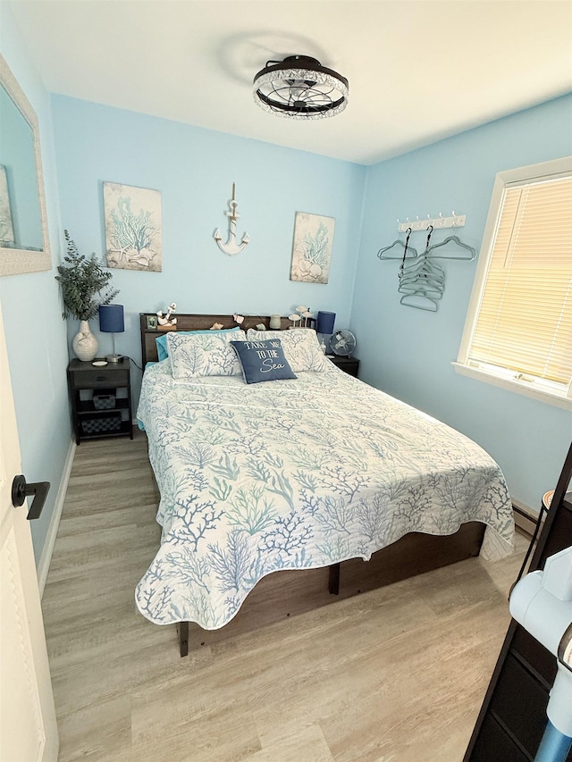 bedroom with light wood-type flooring