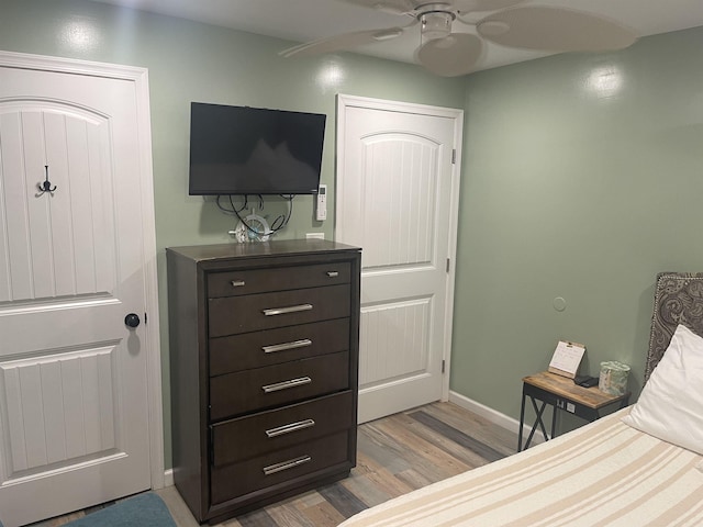 bedroom featuring light hardwood / wood-style floors and ceiling fan