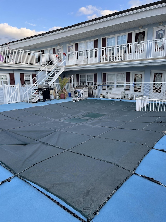 view of swimming pool with grilling area