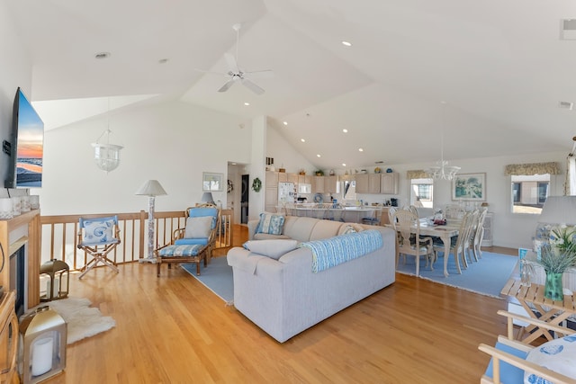 7423 Ocean Dr, Avalon, NJ 08202 - living room with light wood-type flooring, a ceiling fan, high vaulted ceiling, a chandelier, and recessed lighting