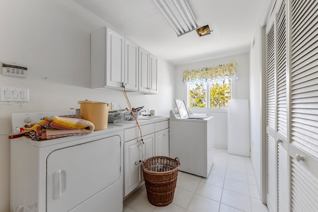 7423 Ocean Dr, Avalon, NJ 08202 - washroom featuring cabinet space, washing machine and dryer, and light tile patterned floors