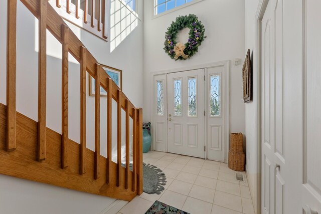 7423 Ocean Dr, Avalon, NJ 08202 - tiled entryway with stairs and a towering ceiling