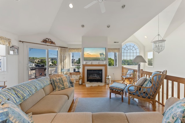 7423 Ocean Dr, Avalon, NJ 08202 - living room featuring lofted ceiling, wood finished floors, a ceiling fan, and a glass covered fireplace