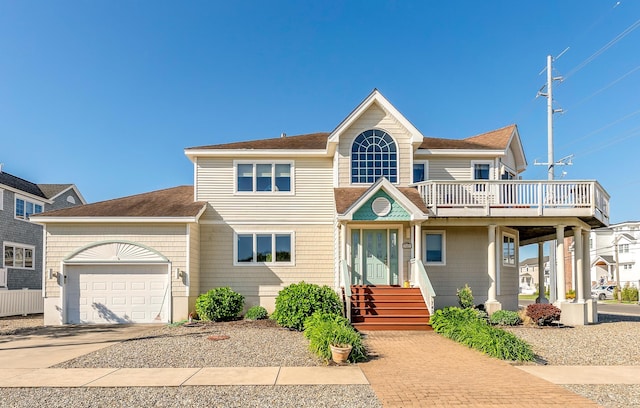 7423 Ocean Dr, Avalon, NJ 08202 - view of front of home with a garage, driveway, a balcony, and a shingled roof