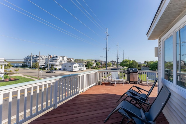 7423 Ocean Dr, Avalon, NJ 08202 - wooden deck featuring area for grilling and a residential view
