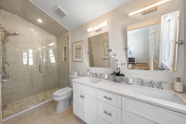10700 3rd Ave S, Unit South, Stone Harbor, NJ 08247 - bathroom featuring a sink, double vanity, toilet, visible vents, and a stall shower