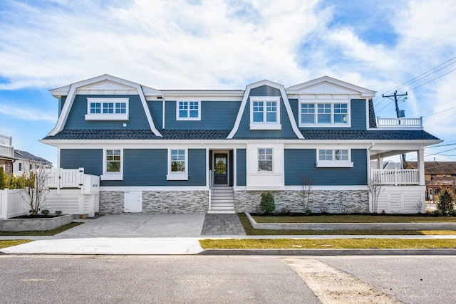 10700 3rd Ave S, Unit South, Stone Harbor, NJ 08247 - shingle-style home with a porch and stone siding