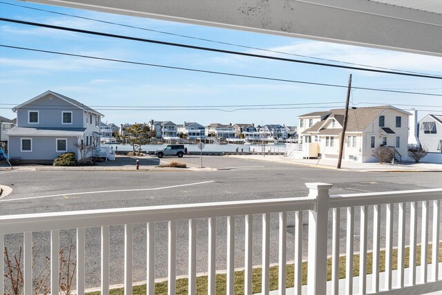10700 3rd Ave S, Unit South, Stone Harbor, NJ 08247 - kitchen with a sink, light countertops, light wood finished floors, and wall chimney exhaust hood