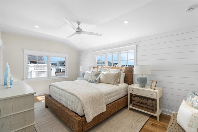 10700 3rd Ave S, Unit South, Stone Harbor, NJ 08247 - bedroom featuring baseboards, multiple windows, light wood-style flooring, and lofted ceiling