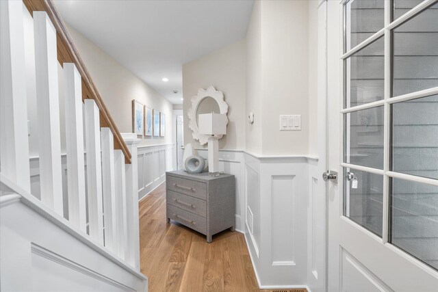 10700 3rd Ave S, Unit South, Stone Harbor, NJ 08247 - foyer entrance with stairway, a wainscoted wall, light wood finished floors, a decorative wall, and recessed lighting