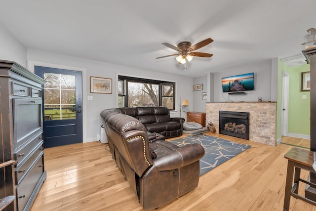 716 Dias Creek Rd, Cape May Court House, NJ 08210 - living room featuring a ceiling fan, light wood finished floors, a fireplace, and baseboards