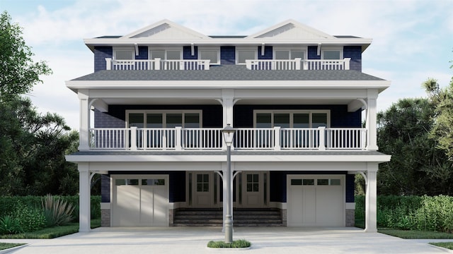 view of front of house featuring a balcony and a garage