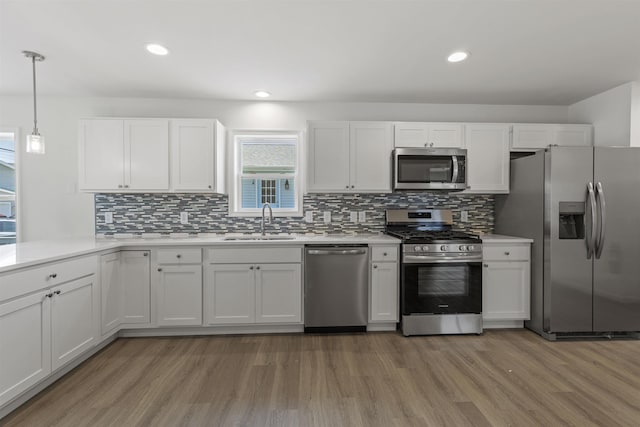 108 Sunray Beach Rd, Del Haven, NJ 08251 - kitchen with appliances with stainless steel finishes, light wood finished floors, backsplash, light countertops, and recessed lighting