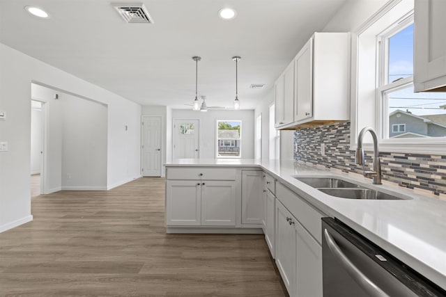 108 Sunray Beach Rd, Del Haven, NJ 08251 - kitchen with dishwasher, a peninsula, recessed lighting, backsplash, and light countertops
