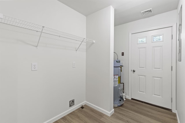 108 Sunray Beach Rd, Del Haven, NJ 08251 - laundry area featuring hookup for an electric dryer, water heater, and light wood-type flooring