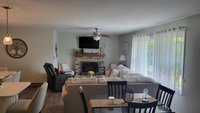 113 Heidi Ave, North Cape May, NJ 08204 - living area with ceiling fan, dark wood-style floors, and a stone fireplace