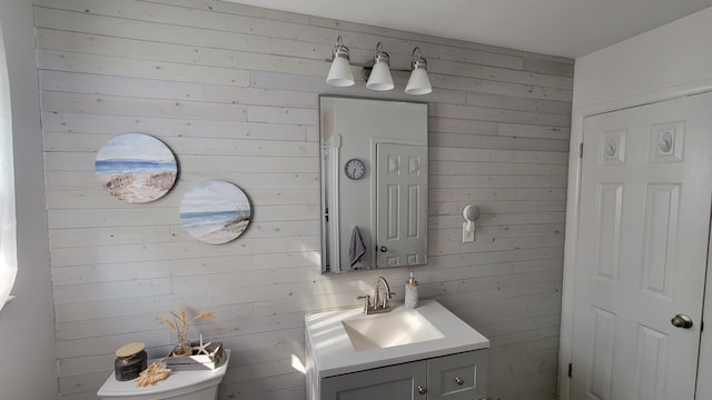 113 Heidi Ave, North Cape May, NJ 08204 - bathroom with wooden walls, vanity, and toilet