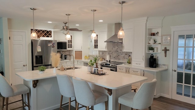 113 Heidi Ave, North Cape May, NJ 08204 - kitchen with appliances with stainless steel finishes, wall chimney exhaust hood, a sink, decorative backsplash, and recessed lighting