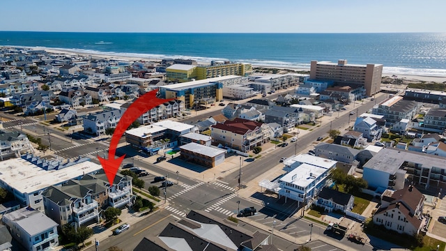 bird's eye view with a beach view and a water view