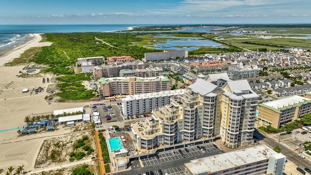 bird's eye view with a view of the beach and a water view