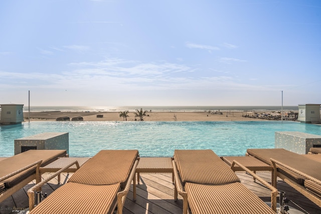 view of swimming pool featuring a water view