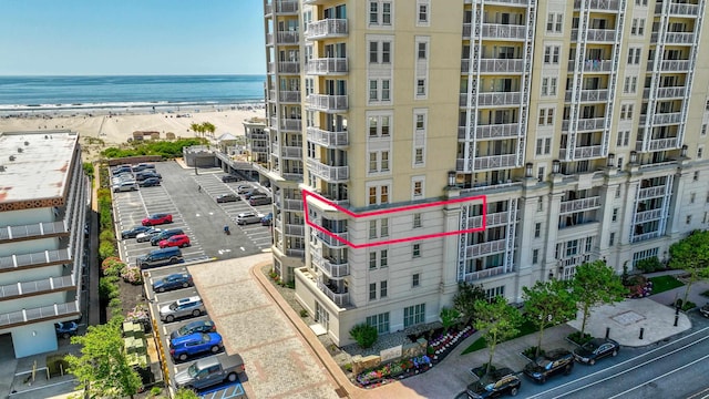 aerial view featuring a water view and a beach view