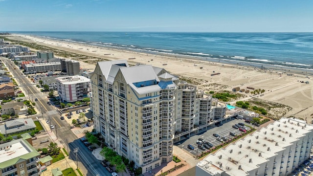 aerial view with a water view and a view of the beach