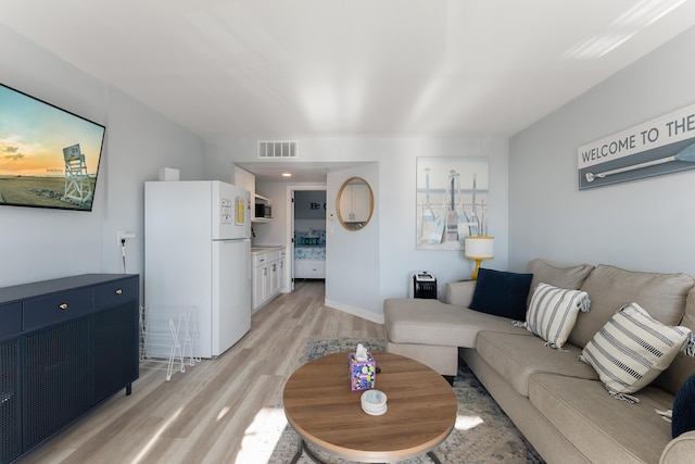 living room featuring light hardwood / wood-style floors