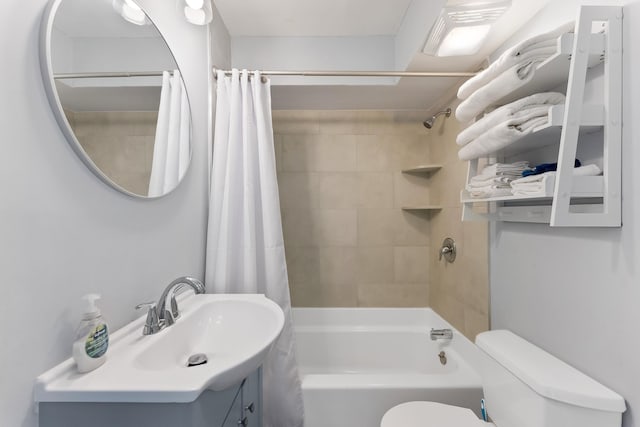 full bathroom featuring shower / bath combination with curtain, vanity, and toilet