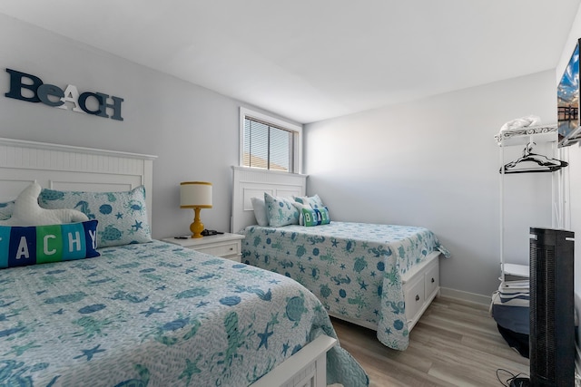 bedroom with light hardwood / wood-style flooring