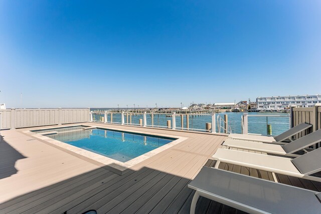 370 83rd St E, Unit East, Stone Harbor, NJ 08247 - view of pool with a water view, a dock, and a pool with connected hot tub