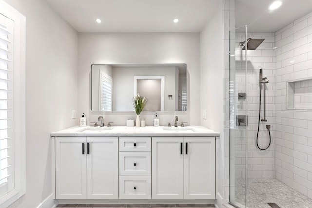 370 83rd St E, Unit East, Stone Harbor, NJ 08247 - bathroom featuring tiled shower, double vanity, and recessed lighting