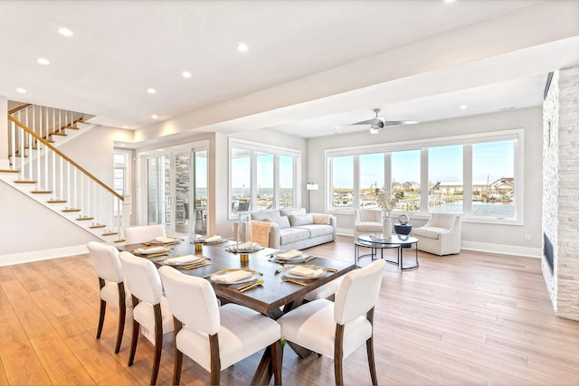 dining room with stairs, baseboards, light wood-style floors, recessed lighting, and a ceiling fan