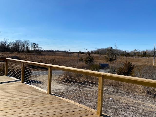 view of dock featuring a rural view and a deck