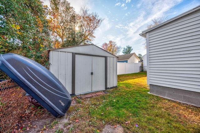 view of outbuilding featuring a yard