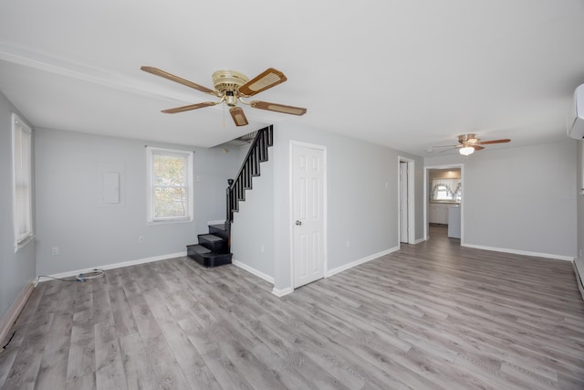 spare room with light hardwood / wood-style floors and ceiling fan