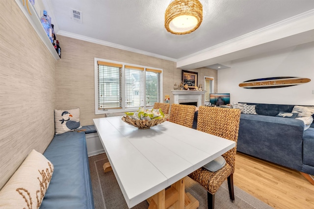 301 E S Station Ave Unit 126, Lower Township, NJ 08260 - dining space with light hardwood / wood-style flooring and ornamental molding