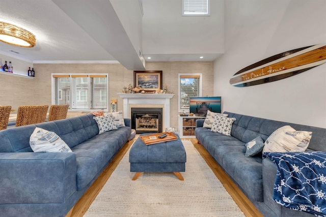 301 E S Station Ave Unit 126, Lower Township, NJ 08260 - living room featuring light hardwood / wood-style floors and crown molding