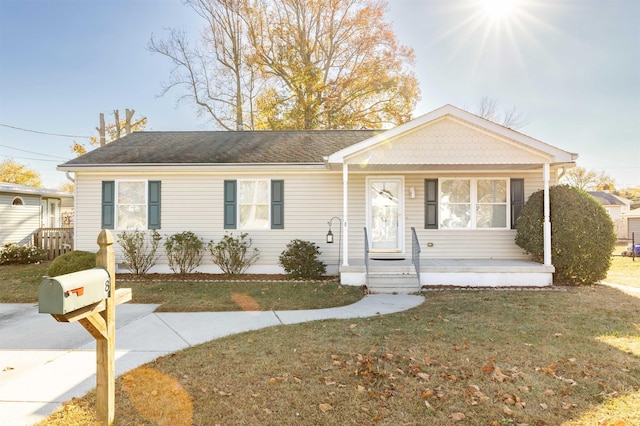 ranch-style home with a front yard