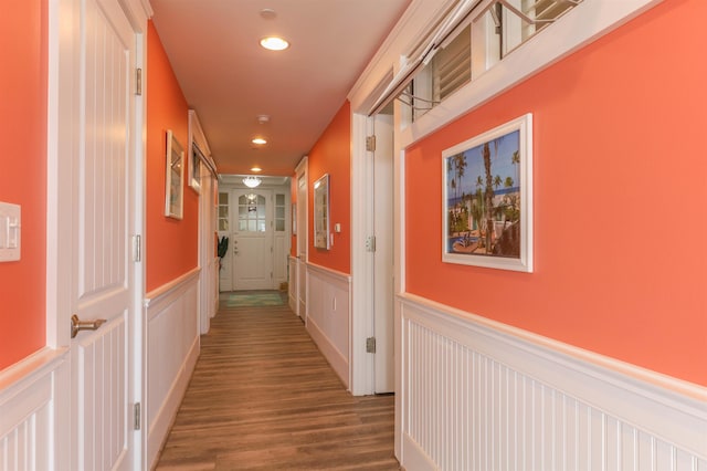 hallway with hardwood / wood-style flooring