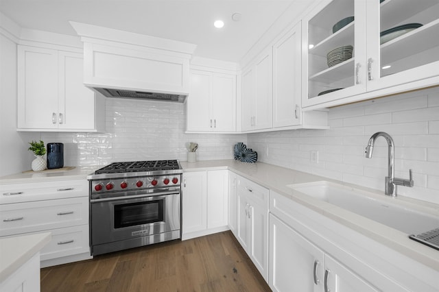 2977 Dune Dr Unit 6, Avalon, NJ 08202 - kitchen featuring designer range, a sink, light countertops, white cabinets, and glass insert cabinets
