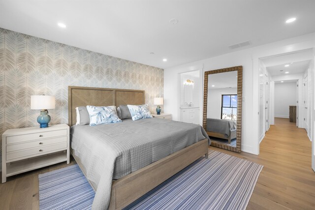2977 Dune Dr Unit 6, Avalon, NJ 08202 - bedroom with wallpapered walls, an accent wall, baseboards, wood finished floors, and recessed lighting
