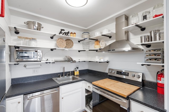 kitchen featuring island range hood, sink, white cabinets, and stainless steel appliances