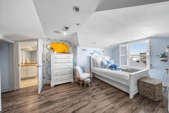 110 W Walnut Ave Unit 103, North Wildwood, NJ 08260 - bedroom with wood finished floors, vaulted ceiling, and ensuite bath
