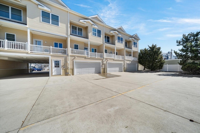 110 W Walnut Ave Unit 103, North Wildwood, NJ 08260 - view of building exterior featuring driveway and an attached garage