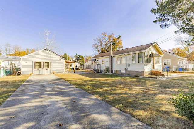 view of front facade featuring a front yard and a carport