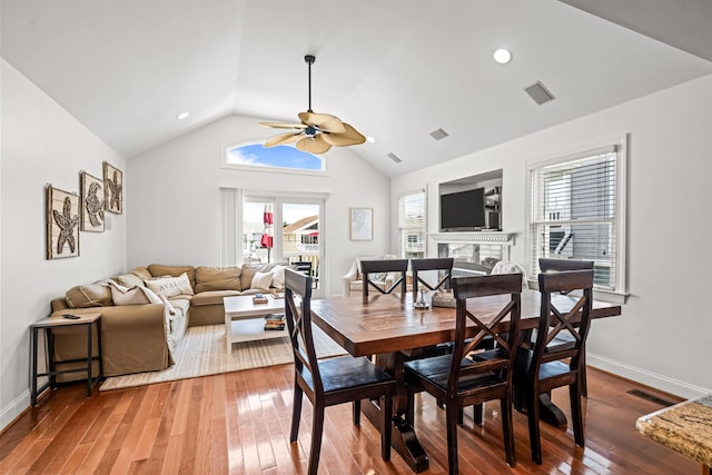 364 41st St E, Unit East, Avalon, NJ 08202 - dining room with wood-type flooring, a fireplace, a ceiling fan, and lofted ceiling